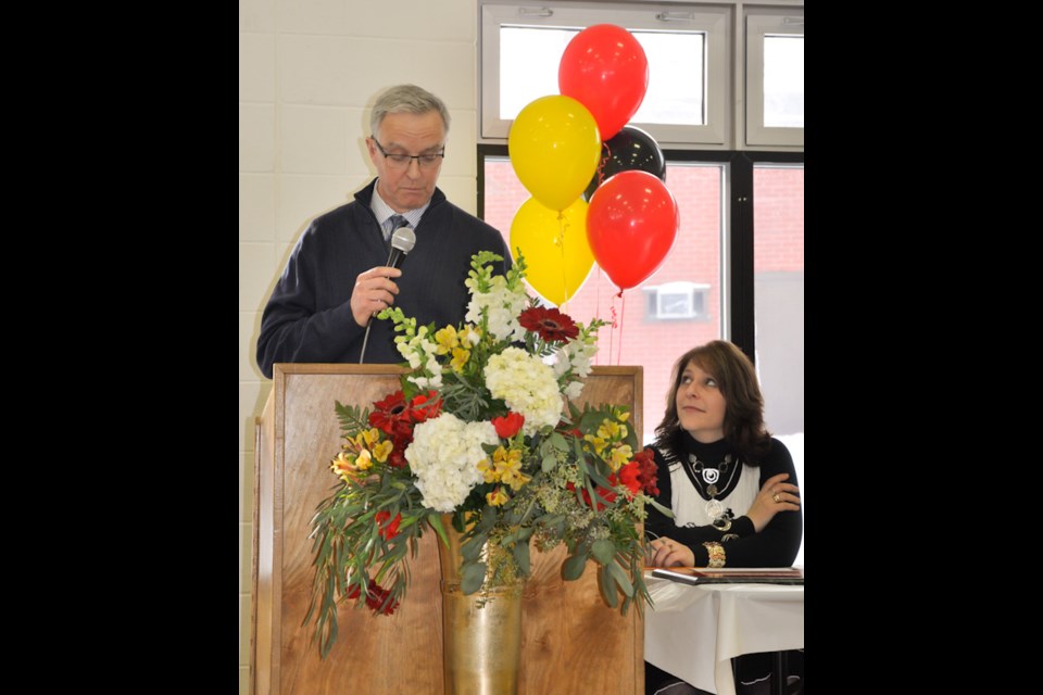 Superintendent of Education, Marcy Bell listens to a heart-felt speech delivered by Johnson Township Mayor, Ted Hicks. Donna Schell for SooToday