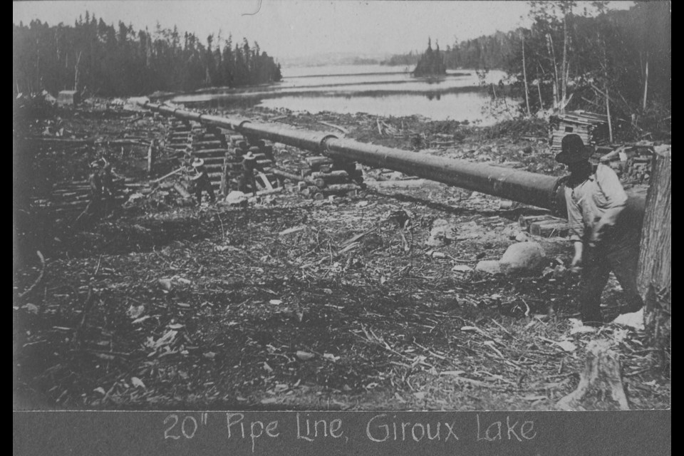 This historic photo shows the construction of the compressed air pipeline. Remnants remain near Giroux Lake. 