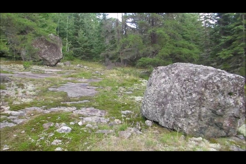 These are two of the four aligned boulders found on the shores of Larder Lake. 