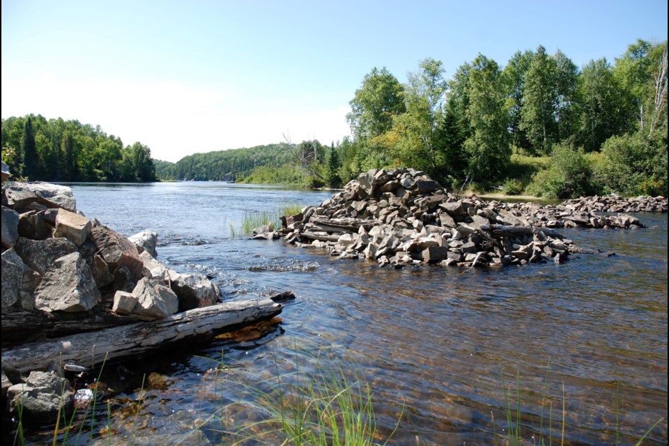 These are the former bridge pilings that connected Dalton Mills and the fording area to cross to reach the cemetery. A canoe is better.