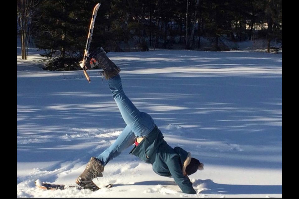 Krystal Henophy of Grounded Studios demonstrates a downward-facing dog.