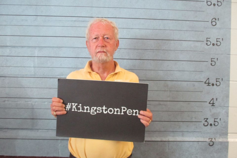 Ron Brown is the author of more than Ontario heritage-travelogue books. He is pictured here promoting one of his historic jail books.