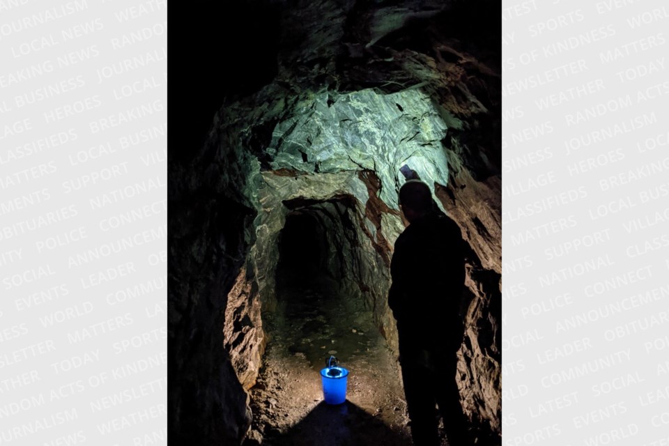 This lantern photo shows the rock-chiseled walls of the Purdy Mica Mine adit.