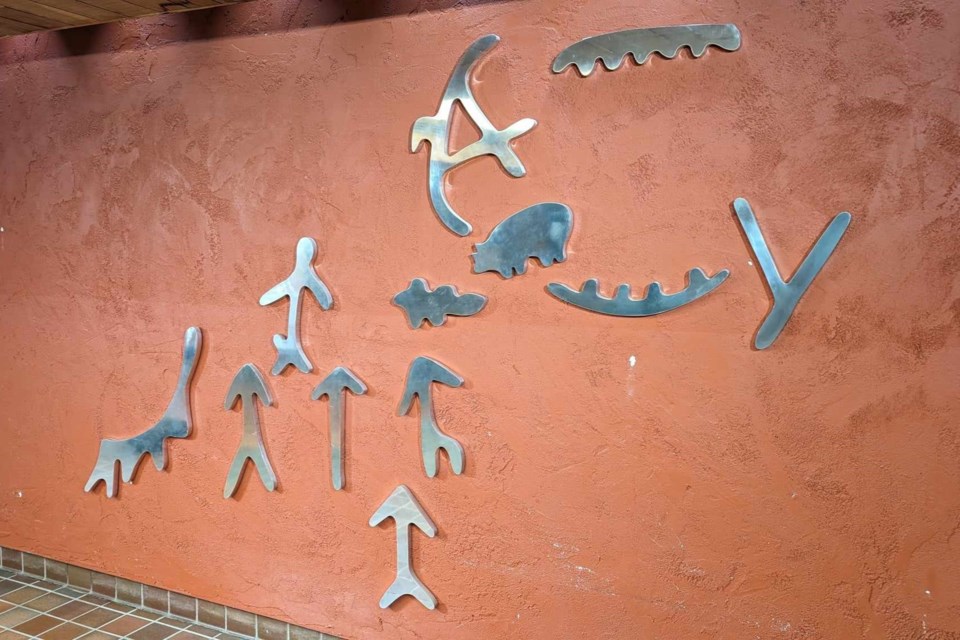 The stylized pictographs have been in the foyer of North Bay's City Hall for more than forty years, but no one seemed to know the origin.