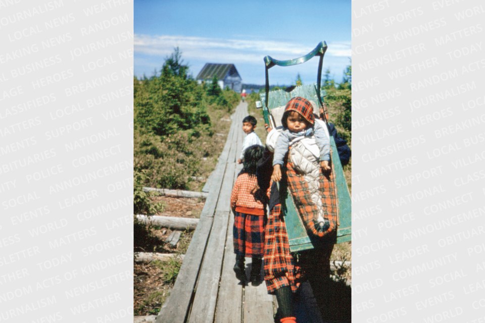 A child in a traditional tikinagun, Lansdowne House.