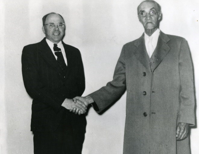 Incoming clerk, Robert Beaton is pictured with retiring clerk Richard M. Moore in Korah Township on June 2, 1954. Sault Ste. Marie Public Library archive photo