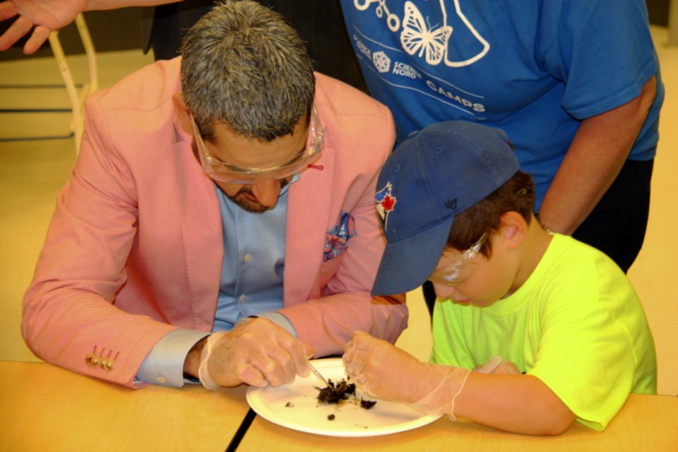 Sault MPP Ross Romano takes part in experiments with children enrolled in Science North’s summer science camp at Ecole Publique Echo des Rapides, Aug. 17, 2018. Darren Taylor/SooToday