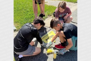 Students spread 'Rainwater Only' message near storm drains