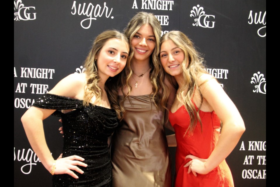 Tori Carbone, St. Mary’s College Student Council president, Abby Macknight, Student Council vice president and Ava Provenzano, Student Council secretary at the school’s A Knight at the Oscars formal and cancer research fundraiser, Feb. 2, 2024. 