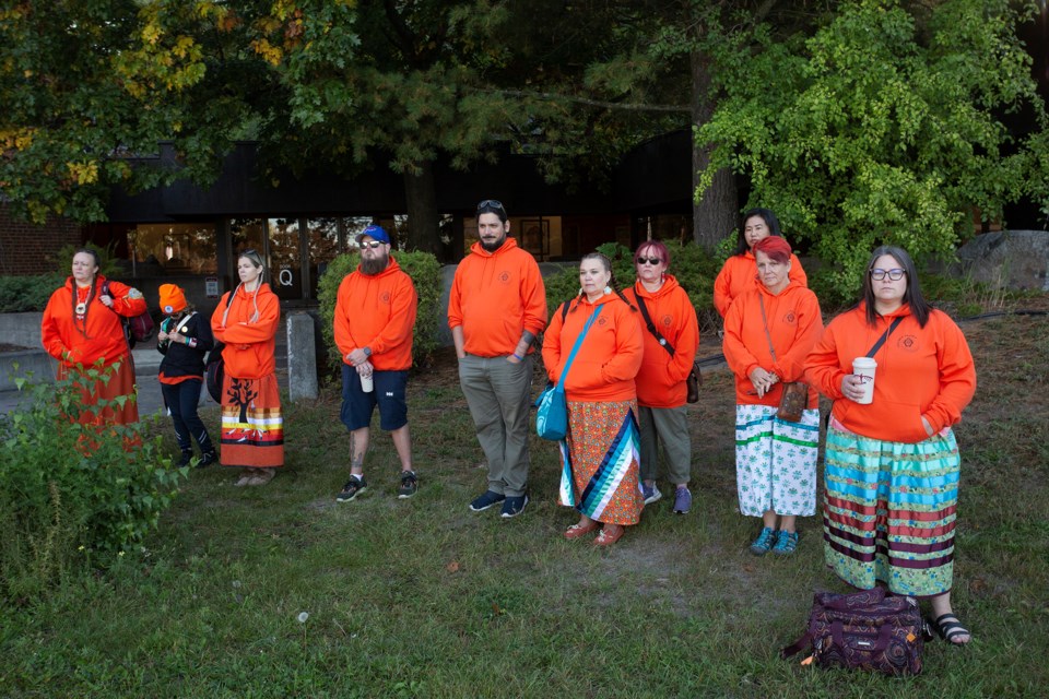 Dozens of people attended Monday's flag raising at Algoma University to mark Orange Shirt Day, otherwise known as the National Day of Truth and Reconciliation.
