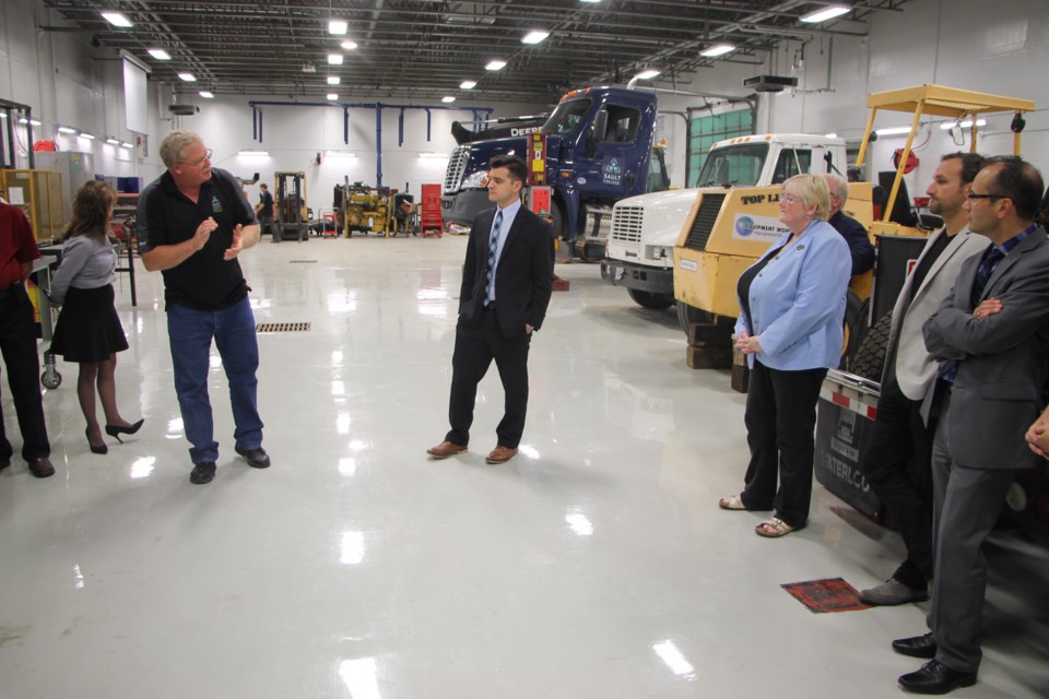 Sault College staff and board of governors members toured the school's improved and expanded Motive Power Lab, September 15, 2016. Darren Taylor/SooToday