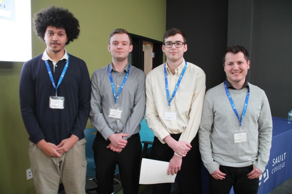 Maxwell Reid, Ethan Bergamin, Justin Milner and Joshua Rodriguez, Sault College electrical engineer automation process program students, are pictured on April 27, 2023.