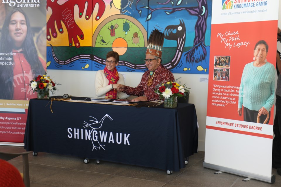 Shingwauk Kinoomaage Gamig (SKG) board chair and Batchewana First Nation Chief Dean Sayers, left, joined Algoma University President Asima Vezina at SKG Friday to sign a pair of collaborative education agreements that will give the Indigenous post-secondary institution more control over Anishinaabe programming going forward. 