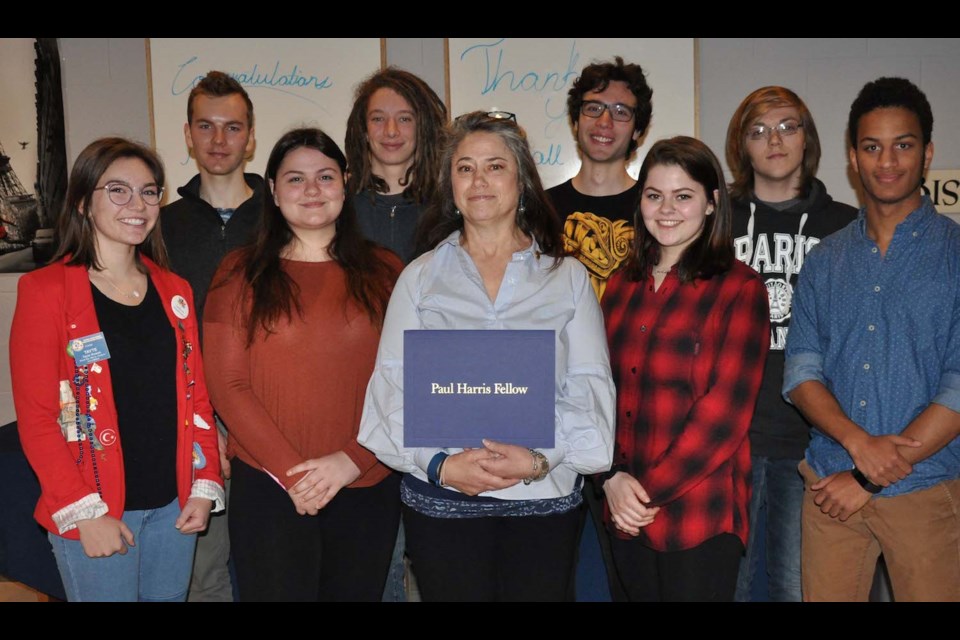 Jill Inch, teacher at Superior Heights, surrounded by many of her World Issues students at Rotary presentation held in her honour. Photo provided
