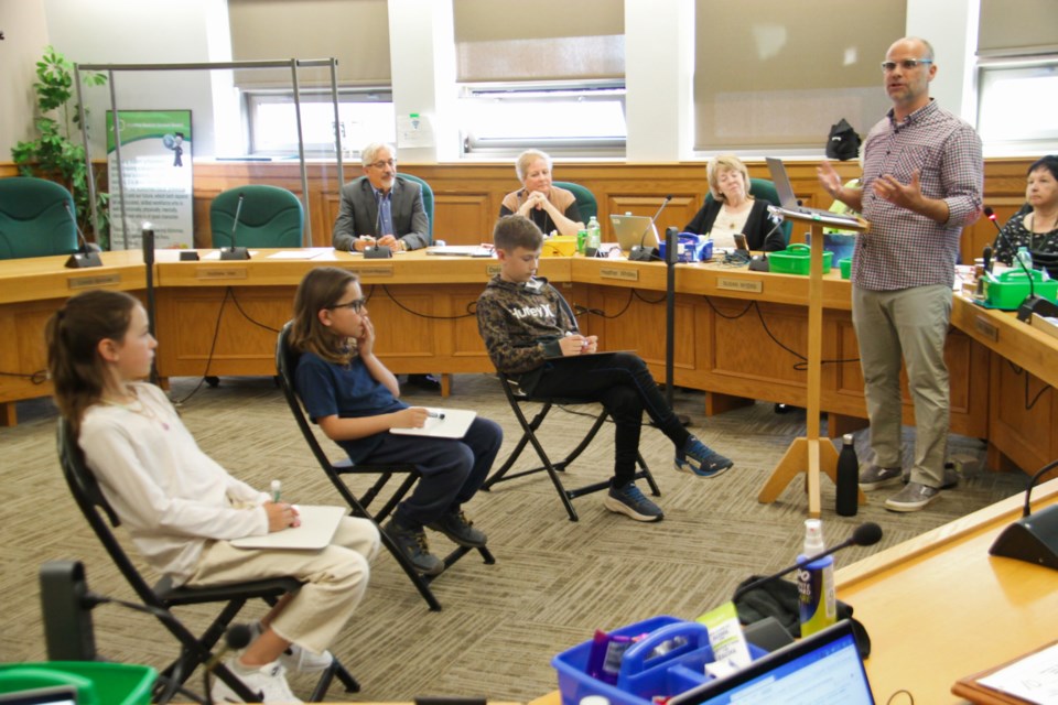 Michael Kelly, Mountain View Public School teacher with students Rhyan O’Connor, Jackson Jonah and Everett Melanson at a math lesson demonstration delivered during an ADSB meeting, April 16, 2024.