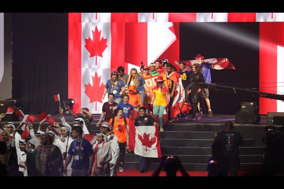 The Canadian team reps pass through the wall of flags that lights up with the Maple-Leaf during the opening ceremonies, immediately following the teams from Bahrain. Photo provided