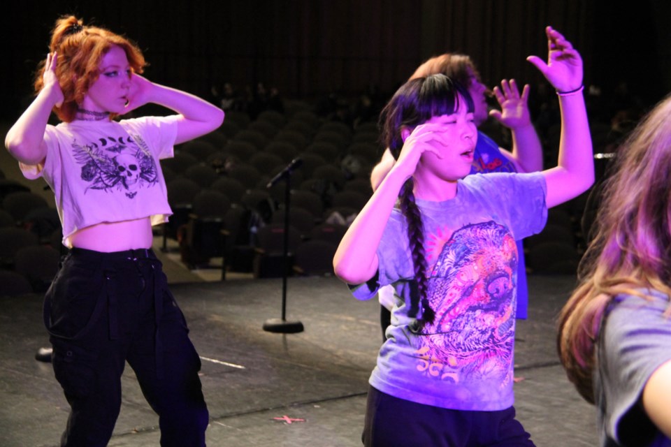 ADSB students learn, rehearse for two March 6 musical variety shows under the direction of Young Americans performers, March 5, 2024.