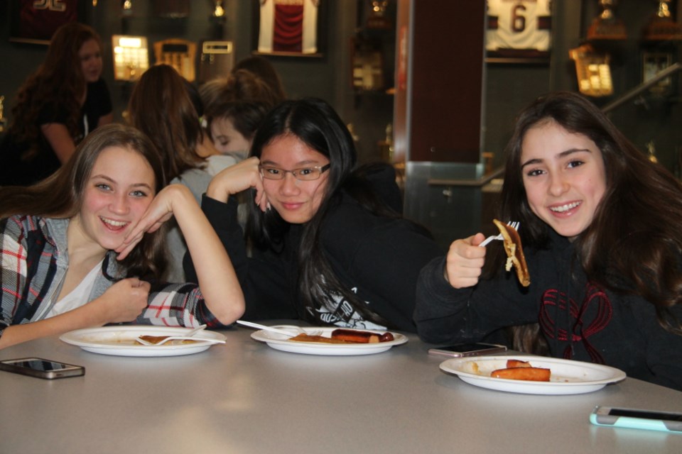 Teachers prepared a pancake and sausage breakfast for students at St. Mary’s College in gratitude for their fundraising work in this year’s Heaven Cent campaign, Dec. 22, 2017. Darren Taylor/SooToday