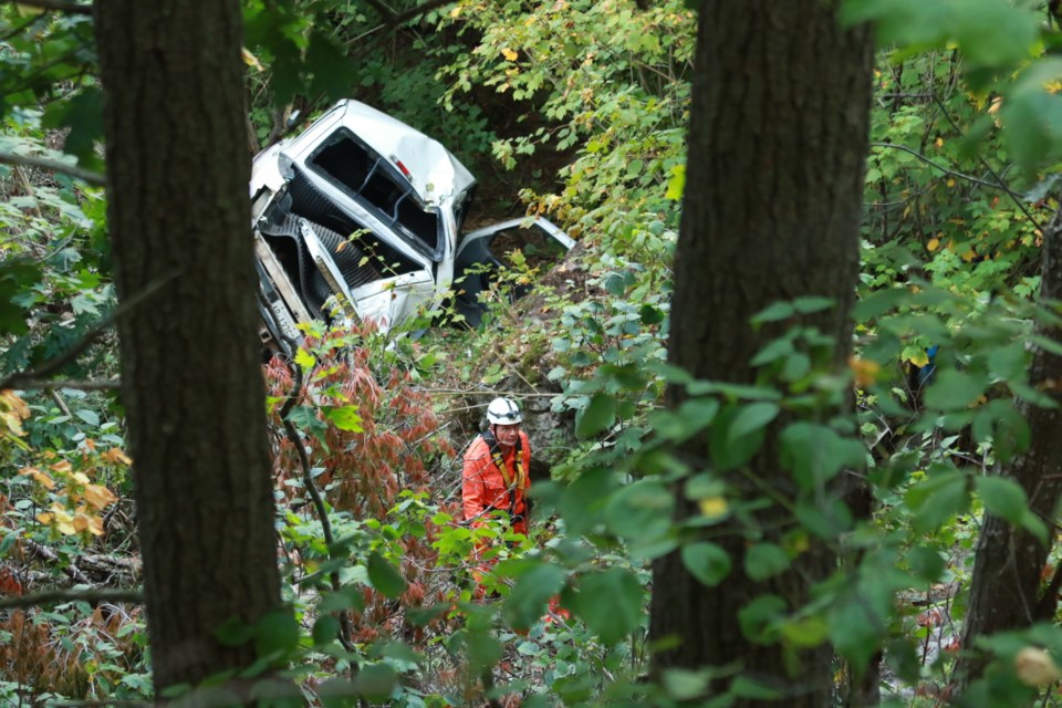 Sault Search and Rescue rappelled down a cliff to conduct a ground search around a vehicle that left the road in the Gros Cap area early Sunday morning. Jeff Klassen/SooToday