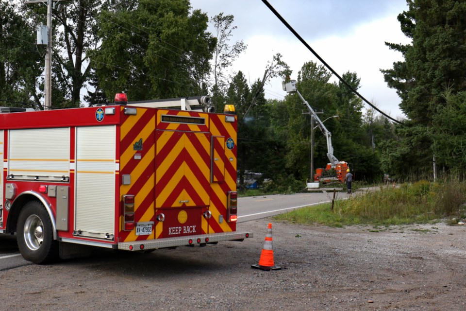 Sault Ste. Marie Fire Services and PUC responded to a report of a tree on fire just north of the intersection of Allens Side Road and Third Line Friday afternoon. The tree caught fire after heavy winds caused the tree to break off and land on a power line. Allens Side Road was closed to traffic as a result. James Hopkin/SooToday