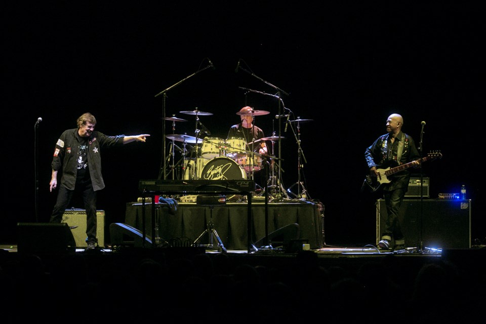 Burton Cummings points to bandmate Jeff Jones onstage during his show Friday at GFL Memorial Gardens as part of the Mocha Shriners Concert Series.