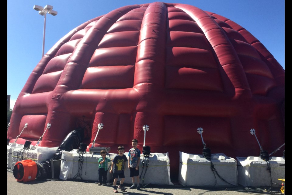 You can't actually bounce in the big red igloo. But free screenings of the 22-minute film Horizon: A 360-Degree Journey are being offered through Thursday in the Sesqui cinematic dome outside Station Mall, David Helwig/SooToday