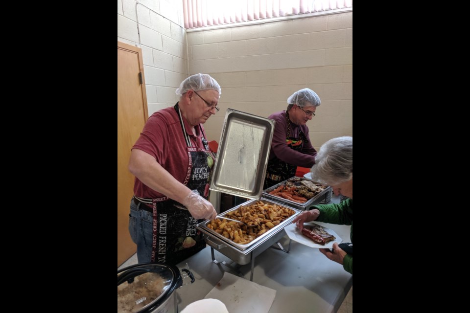 Volunteers serving up the homemade food that smelled delicious! Sandi Wheeler/SooToday