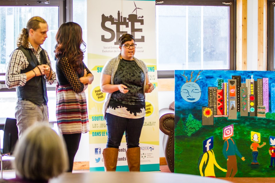 Artists Spencer Rice, Thunder Nanni and Janique Danis discuss the murals during the Urban Indigenous Youth for Change mural project presentation at Sault College, Enjimaawdjining on Thursday, Dec. 8, 2016. Donna Hopper/SooToday