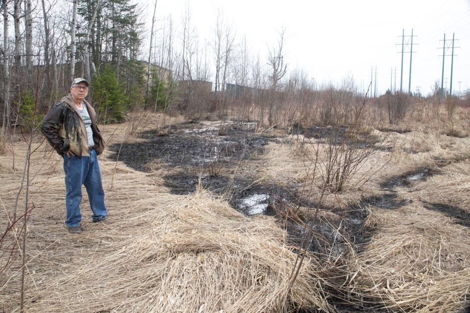 Lou Salvalaggio is concerned a black oily substance that he found Friday near Fort Creek will not be cleaned up before more damage is done to the local ecosystem.