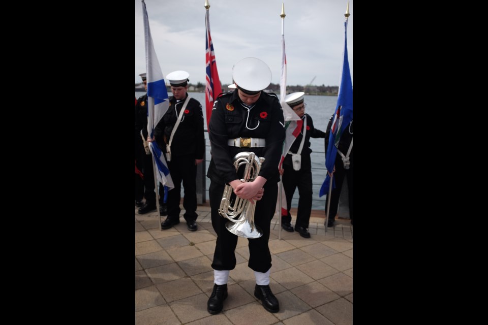 A cadet with the RCSCC Royal Sovereign Sea Cadets prays during a service to commemorate those who died during the Battle of the Atlantic on Sunday. Photo by Jeff Klassen for SooToday