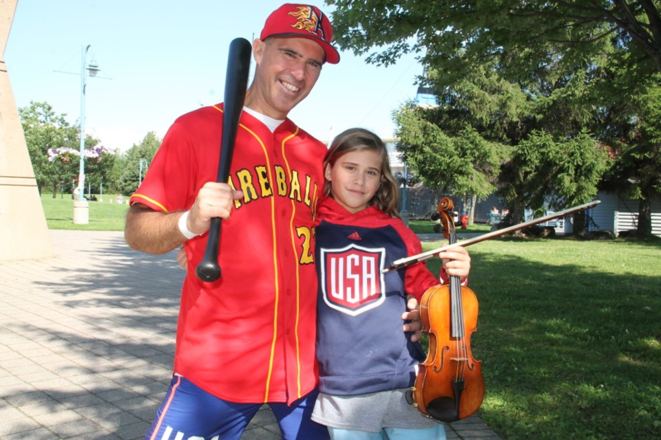 Toronto-based street performer Paz and his son, Nik the Violin Kid, two artists taking part in the Sault’s inaugural Fringe North International Theatre Festival, being held from Aug. 10 to 20, 2017.  Darren Taylor/SooToday 