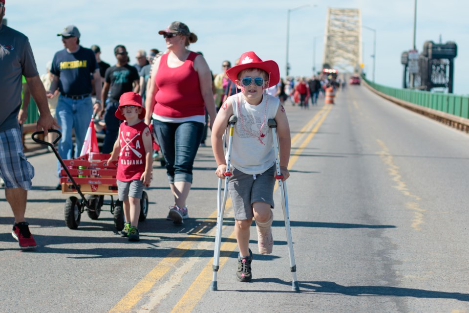 Despite his possibly-broken ankle, Camden McLeod, 7, took part in the bridge walk. June 24 was the 31st International Bridge Walk and Bike Parade. Jeff Klassen/SooToday
