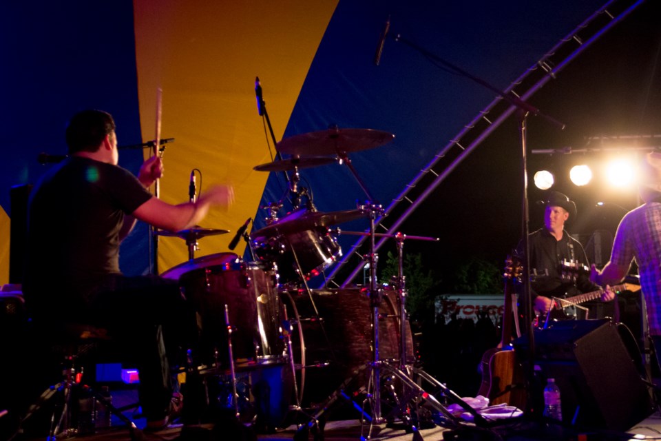 On Saturday night, drummer Dean McKey of The McCartney Years hopped on the drums for three songs during his brother's band The Ghost Town Cryers' set at Rotaryfest. After moving away from the Sault, the brother's came back this year as both their bands headlined the main stage at the festival. Photo by Jeff Klassen for SooToday