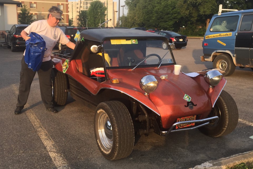 Brian Gomez of Exton, Pennsylvania loads up his 1970s-era fiberglass dune buggy kit car Thursday at Sault Ste. Marie's Sleep Inn. The vehicle is so widely despised that Gomez gets 300 bonus rally points for daring to be seen in it. David Helwig/SooToday