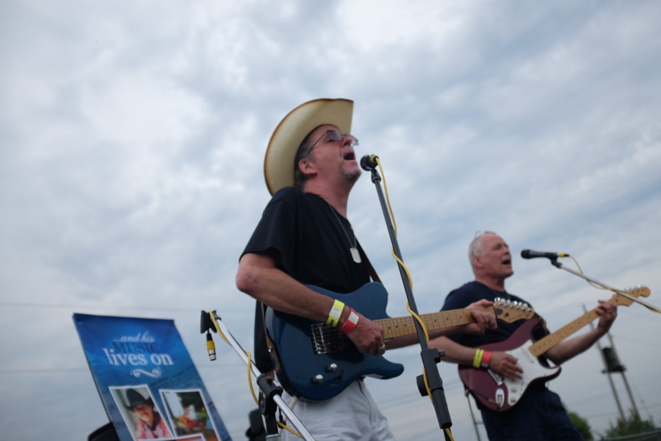 Jeff McNeice (hat) and Morgan Steele performing at the Mike Case Country Music Festival in Laird on Saturday. Photo by Jeff Klassen for SooToday