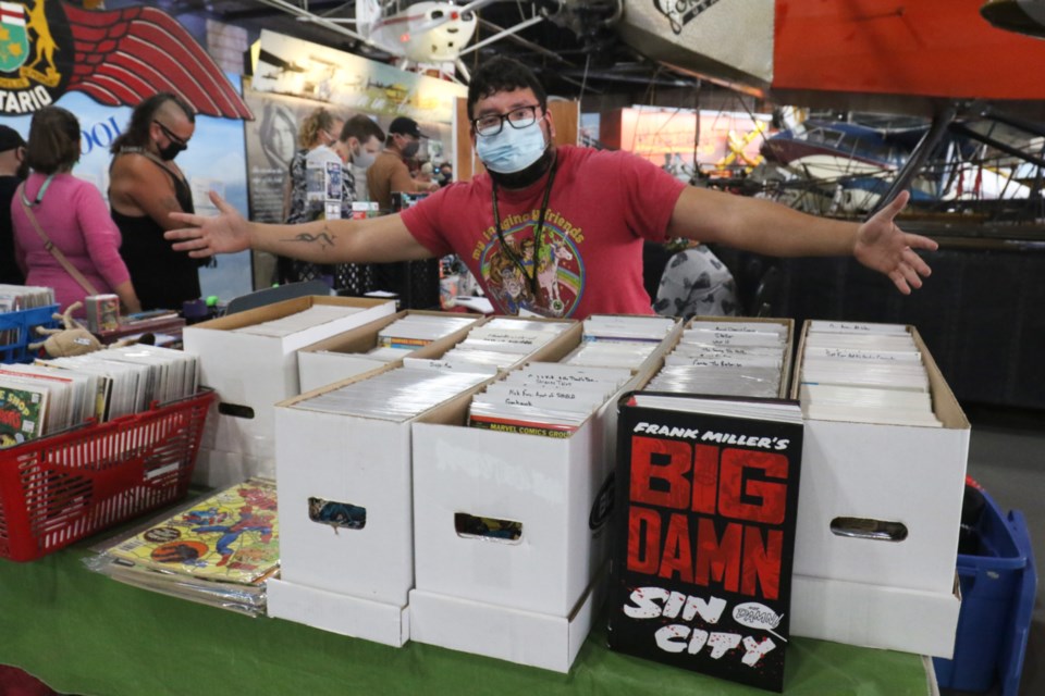 EB Comics owner and The Rad Zone employee Evan Belleau with his stash of comic books. 