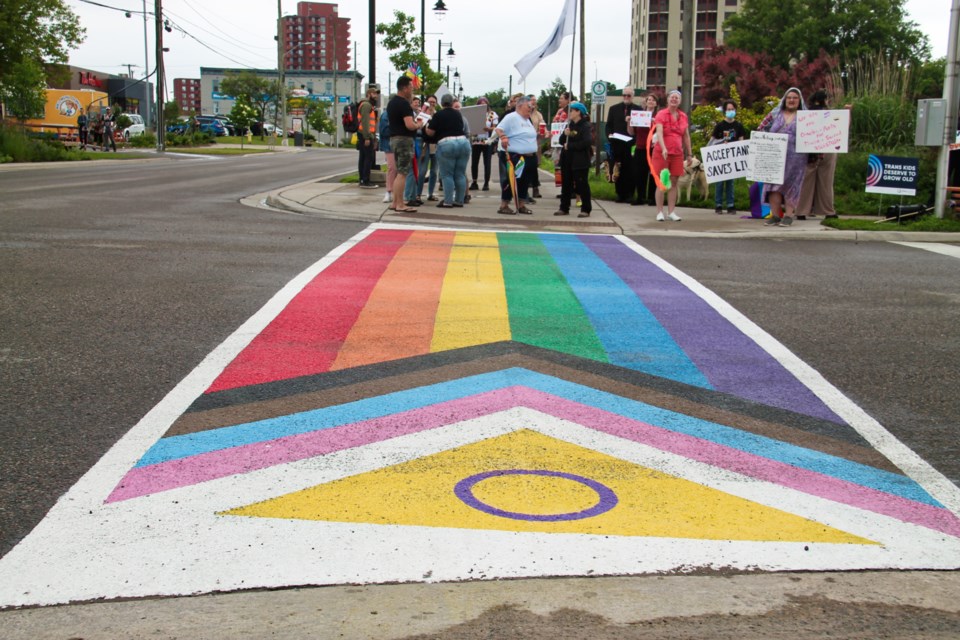 Members of the Sault’s 2SLGBTQIA+ community gathered at the Pride crosswalk at the corner of Bay and Spring Streets, June 29, 2024.