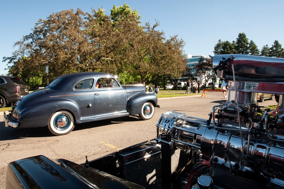 A car leaves the staging area during the Queen Street Cruise Parade of Cars, held Friday in Sault Ste. Marie.