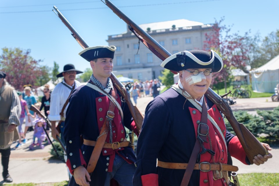 Historical reeneactor Jim Roth marches towards the battlefield as a soldier of the Massachusetts Bay Colony at Rendezvous in the Sault on Saturday. Jeff Klassen/SooToday
