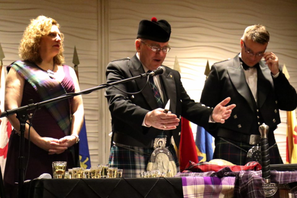 The haggis is blessed during the MacLeod Highland Dance Studio's annual Robert Burns Dinner at the Marconi Saturday night. James Hopkin/SooToday