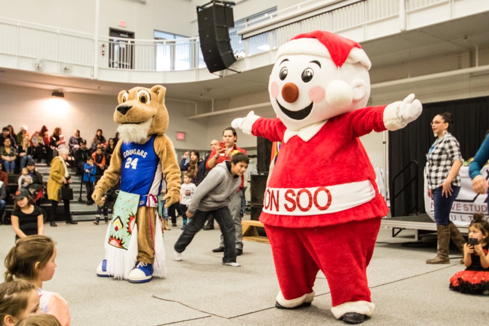 Mr. Bon Soo and Corby the Cougar had a friendly dance off during the annual Sault College Pow Wow at the Health and Wellness Centre on Saturday, Feb. 11, 2017. Donna Hopper/SooToday
