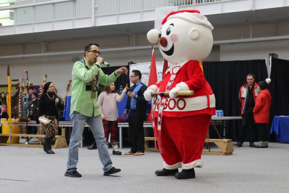 Sault College Pow Wow MC Joel Syrette introduces Mr. Bon Soo during Saturday's mascot dance-off. James Hopkin/SooToday 