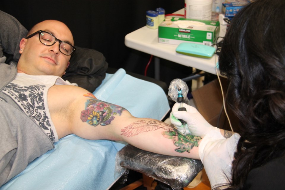 Local tattoo artists gave new tattoos to customers, other folks  showed off their existing tats, while others received body piercings at the Sault’s first Tattoo Convention held at The TECH, Apr 7, 2018. The convention kicked off with a performance by comedians Friday, with a tattoo artist competition continuing through Sunday, a cash prize of $1,200 going to the winner. Entrance fees for the artists go to the Sault Ste. Marie Soup Kitchen Community Centre. Darren Taylor/SooToday