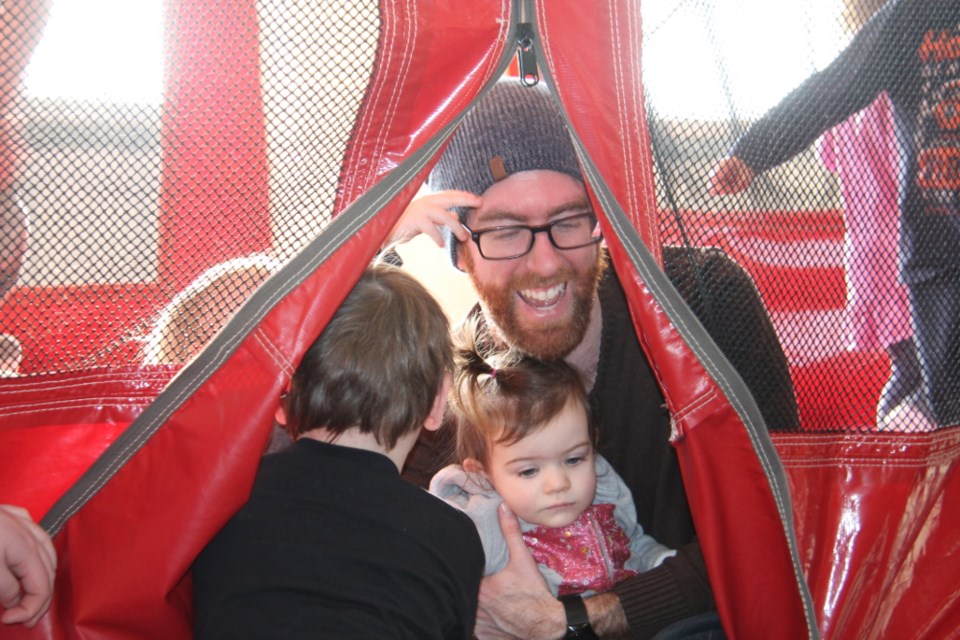 Scott Martin with daughter Claire during Bon Tots Sunday Fun-day, a Bon Soo event held at the Canadian Bushplane Heritage Centre, Feb. 4, 2018. Darren Taylor/SooToday 