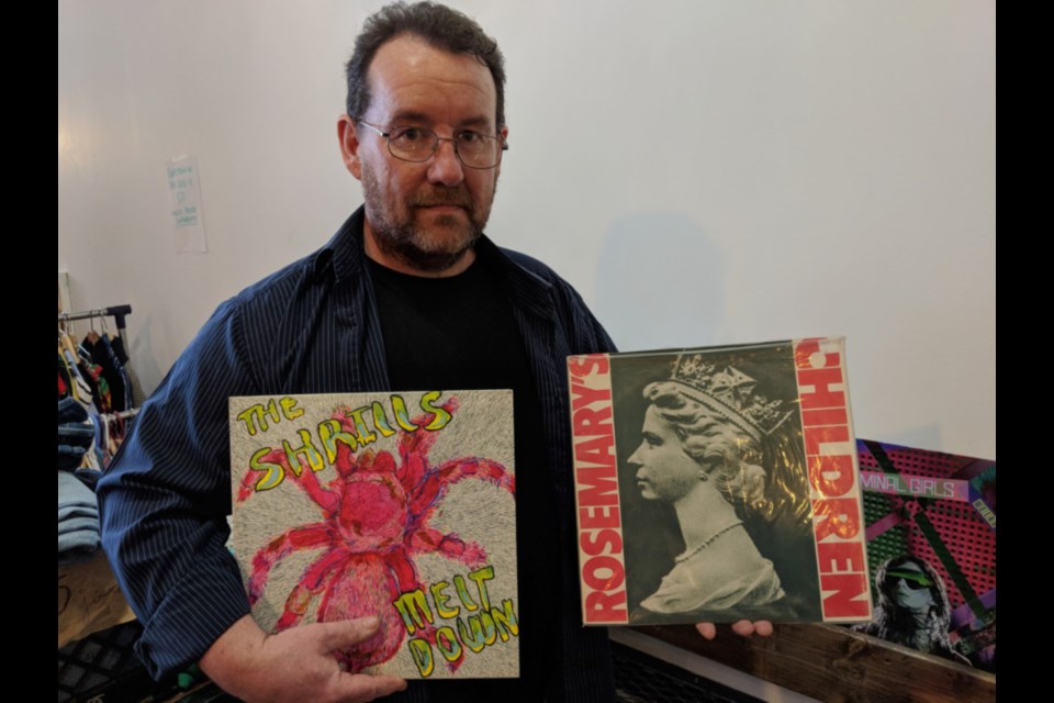 Pete Moran, Fishbowl Festival supporter, with vinyl LPs available for sale at the Oosik Records vending booth as the fourth annual Fishbowl Festival kicked off with a vintage merchandise sale at Outspoken Brewing, March 3, 2019. Darren Taylor/SooToday