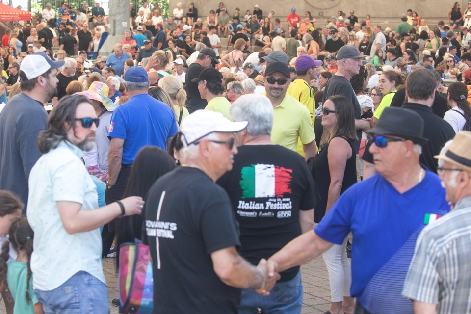 Catching up at Giovanni's Italian Festival, held Sunday at the Bondar Pavilion in the city's downtown.