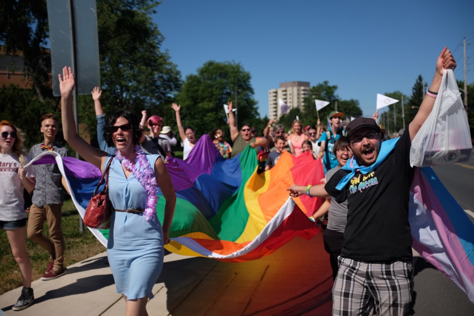 Around 100 people marched in celebration and support of the LGBT community on Saturday during the 2016 Pride Walk. Photo by Jeff Klassen for SooToday 
