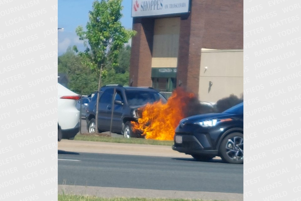 A vehicle's front end was engulfed in flames in the Giant Tiger parking lot on Monday afternoon.