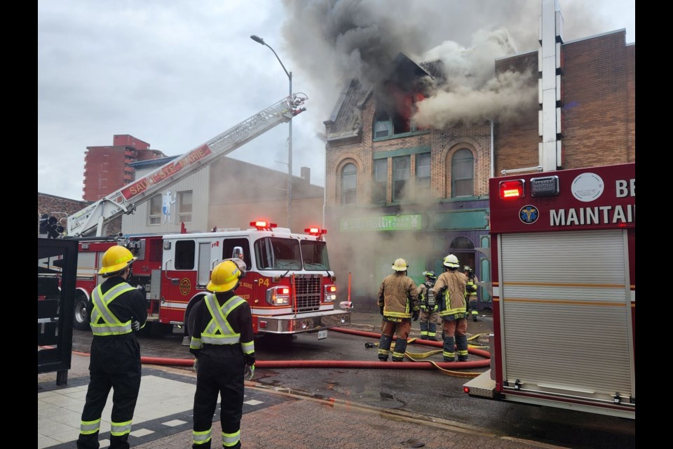 Firefighters douse a fire at 647 Queen Street East on Wednesday, May 8, 2024
