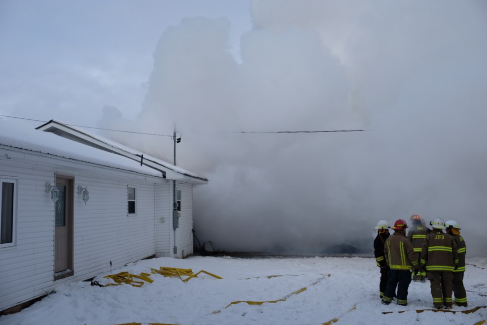 Firefighters battle a house fire three kilometres west of Desbarats on Highway 17. Jeff Klassen/SooToday